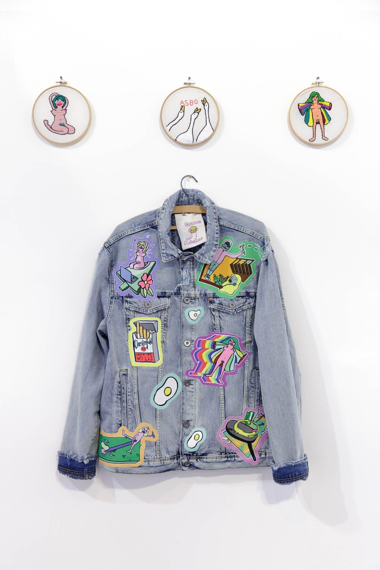 Denim jacket with colourful patches