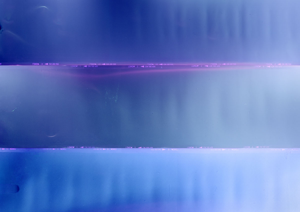 A close-up of a surface featuring horizontal stripes in various shades of blue and purple. The colours blend softly into one another, creating a smooth gradient effect.