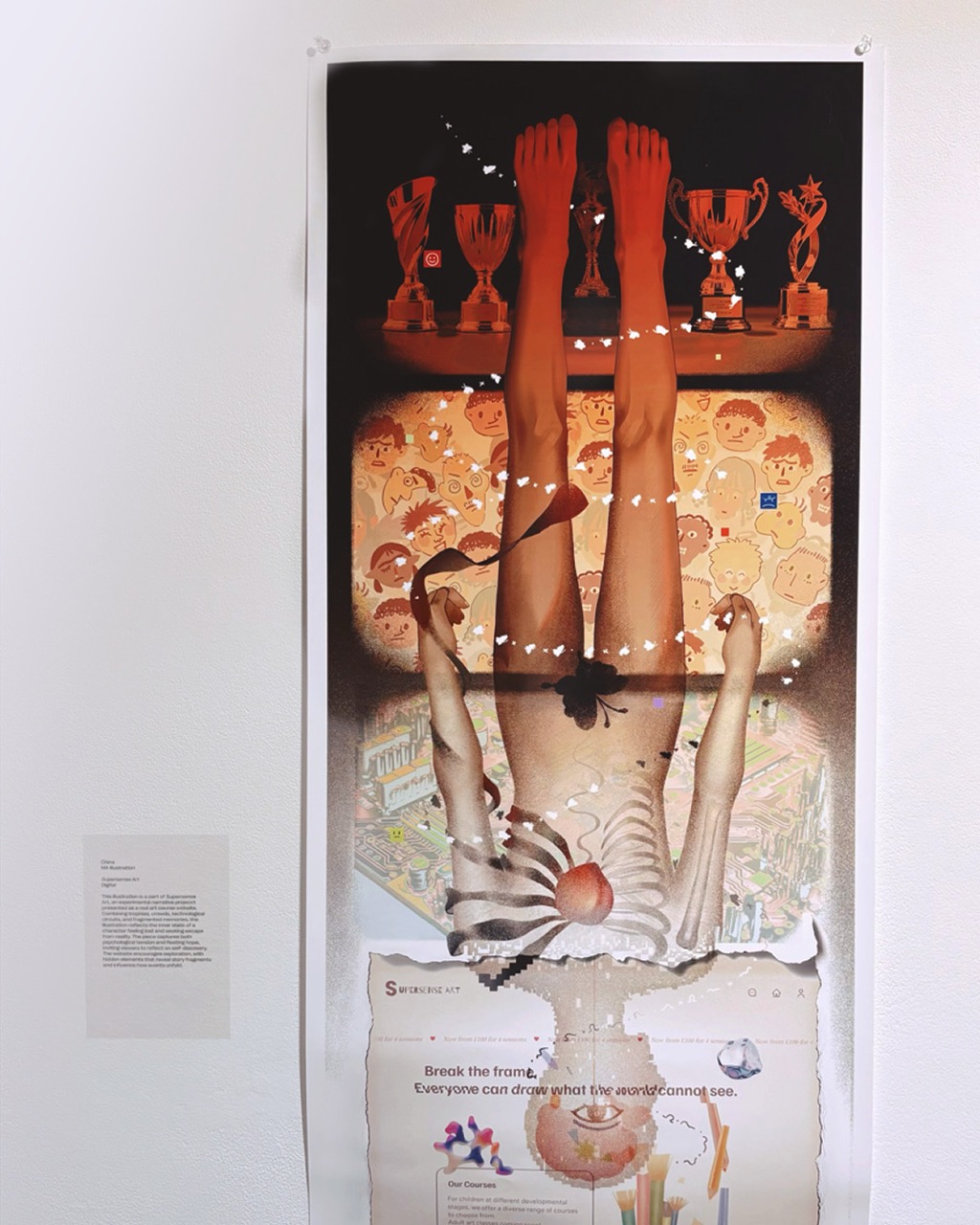 A vertical mixed-media artwork on a white gallery wall shows an upside-down figure with legs raised, trophies along the top edge, and layered collage imagery below.