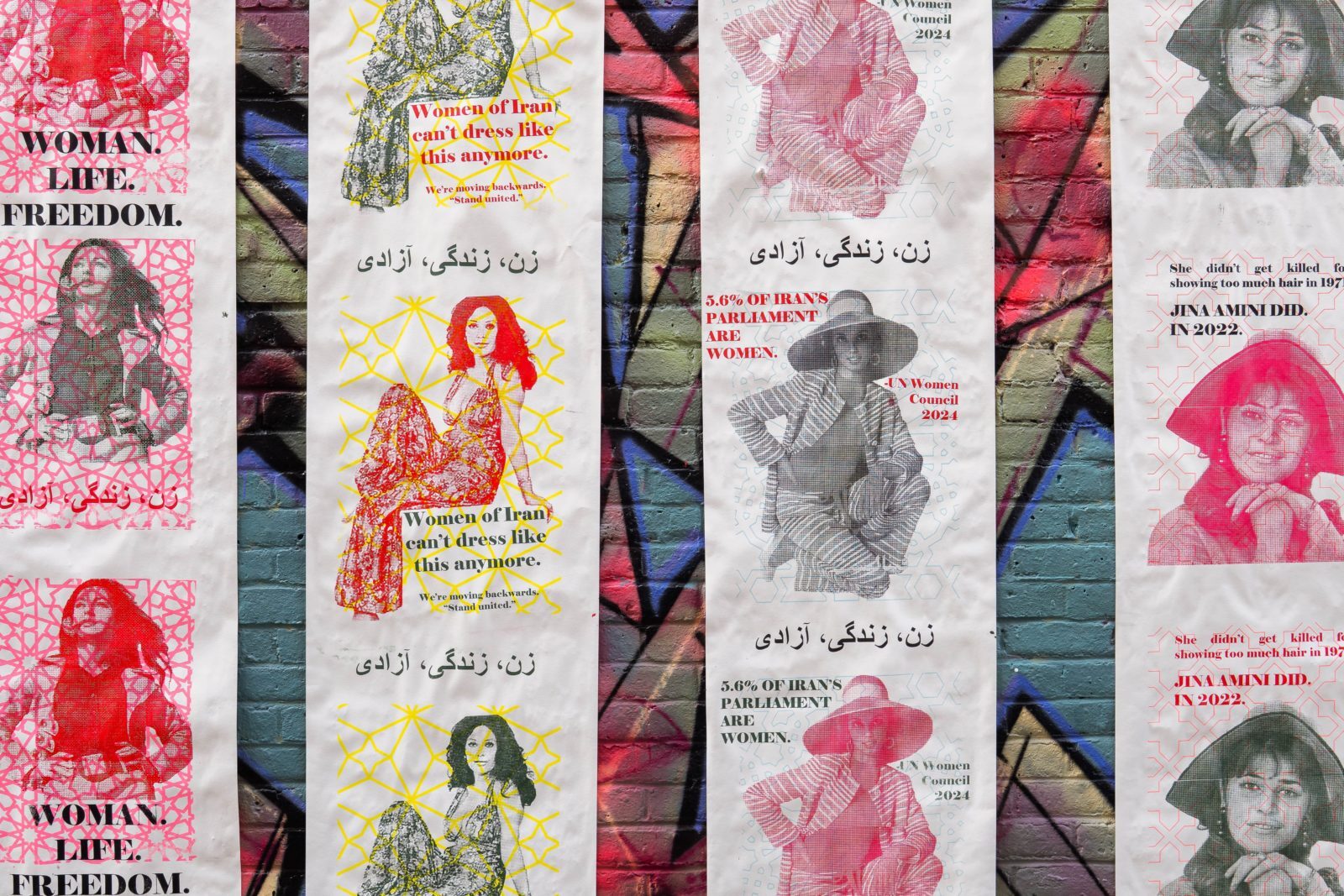 Collage of protest posters with red, pink, and yellow colours featuring women's portraits and text including "Woman, Life, Freedom"