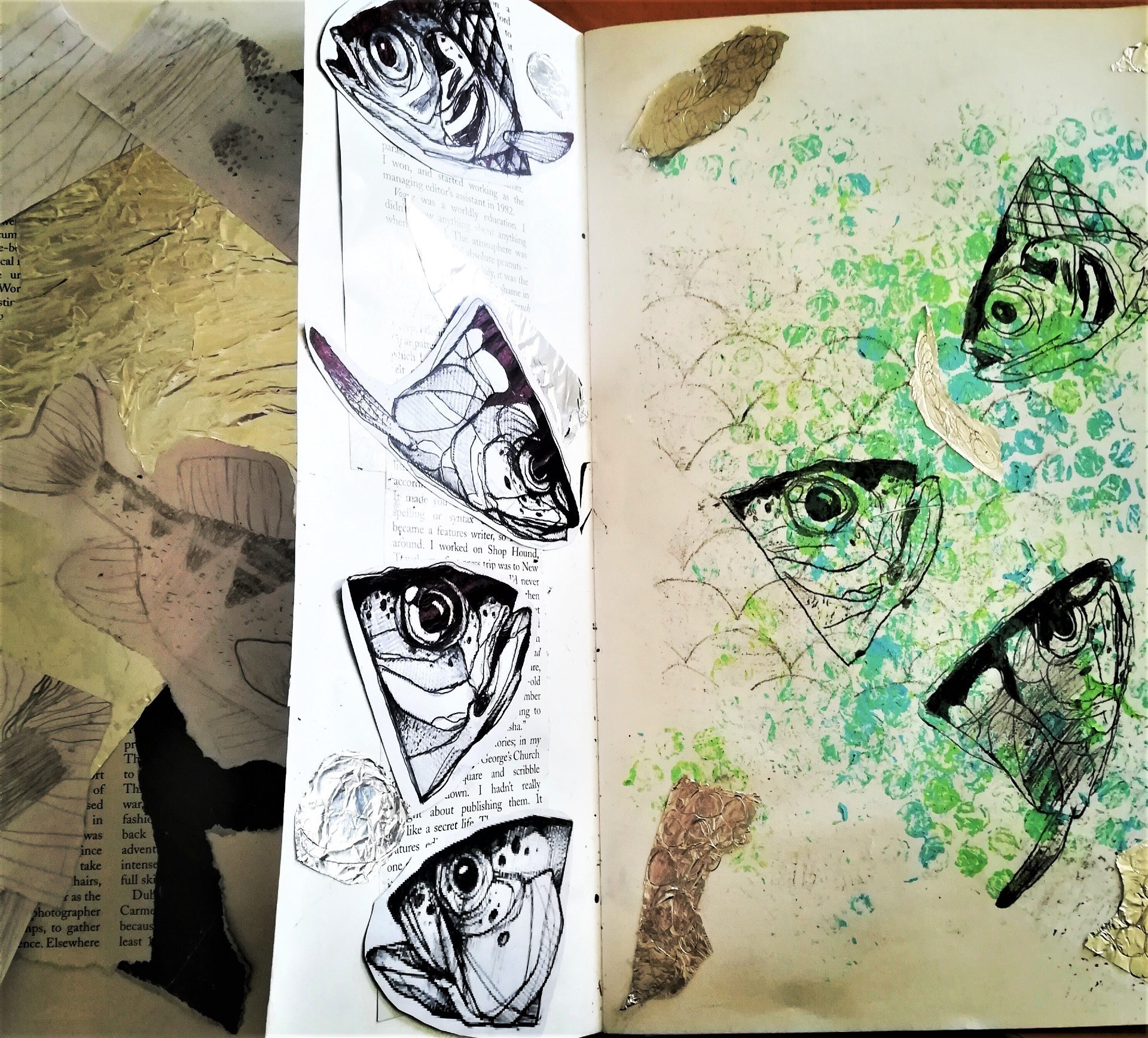 Document with prints of fish heads and scales stuck and stamped onto the pages.