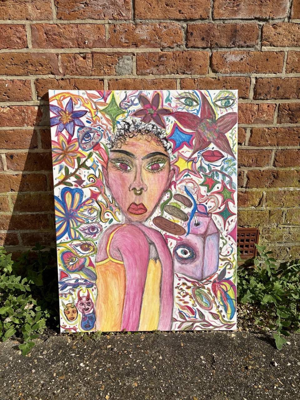 A colourful painting featuring a woman with bold makeup and curly hair, surrounded by vibrant patterns of flowers and stars. She holds a slice of cake, and the background is filled with an abstract design in various hues.