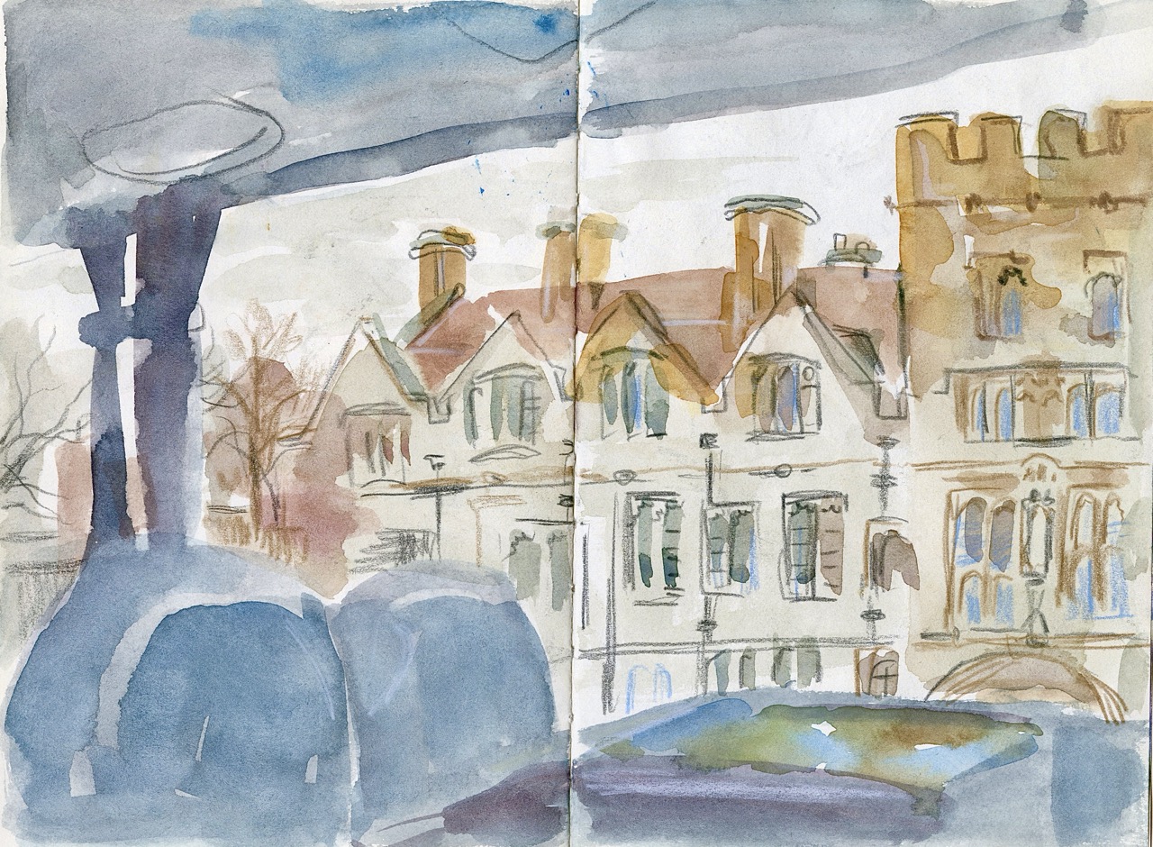 A watercolour painting of houses with red roofs and a castle-like building, seen behind blue trees and a foreground of rounded shapes under a cloudy sky.
