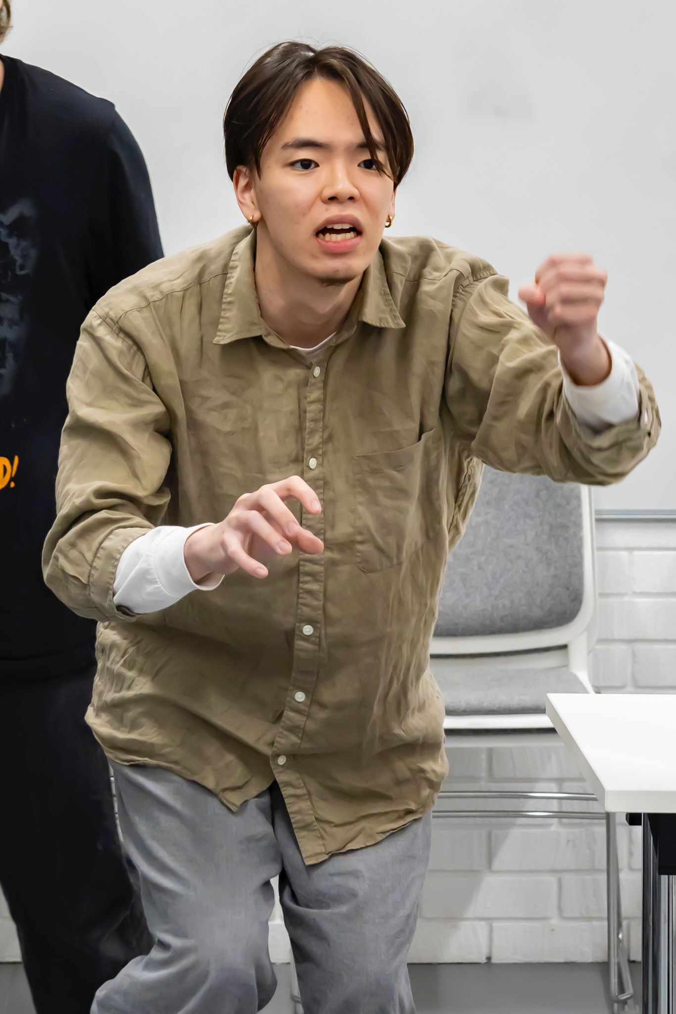 Mitsuki Kawase rehearsing mid-scene.