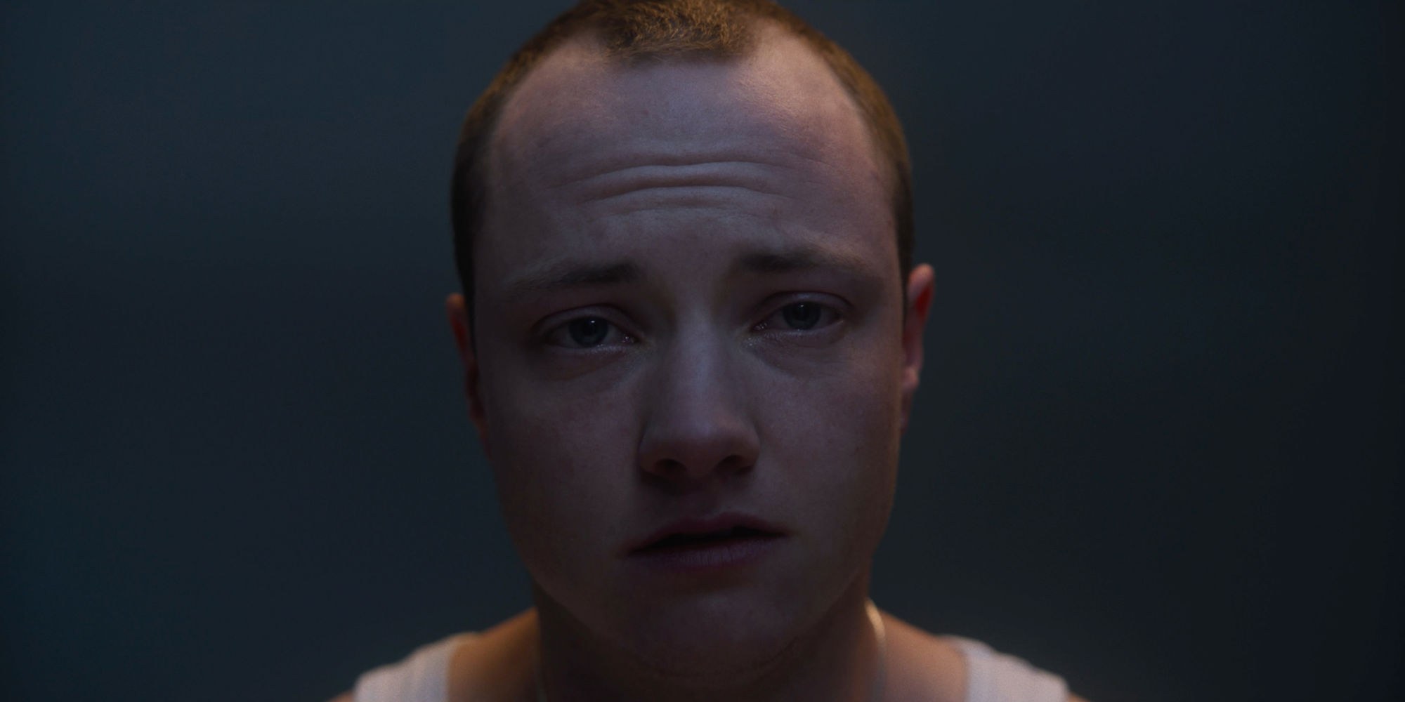 Still from Jesse Reece-Lewis' award-winning short film, Eyelash. A person stares at the camera with a distressed expression.