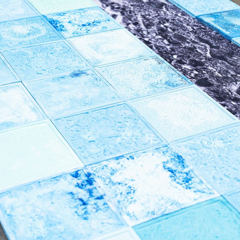 Blue glass watery tiles as part of an art exhibition.