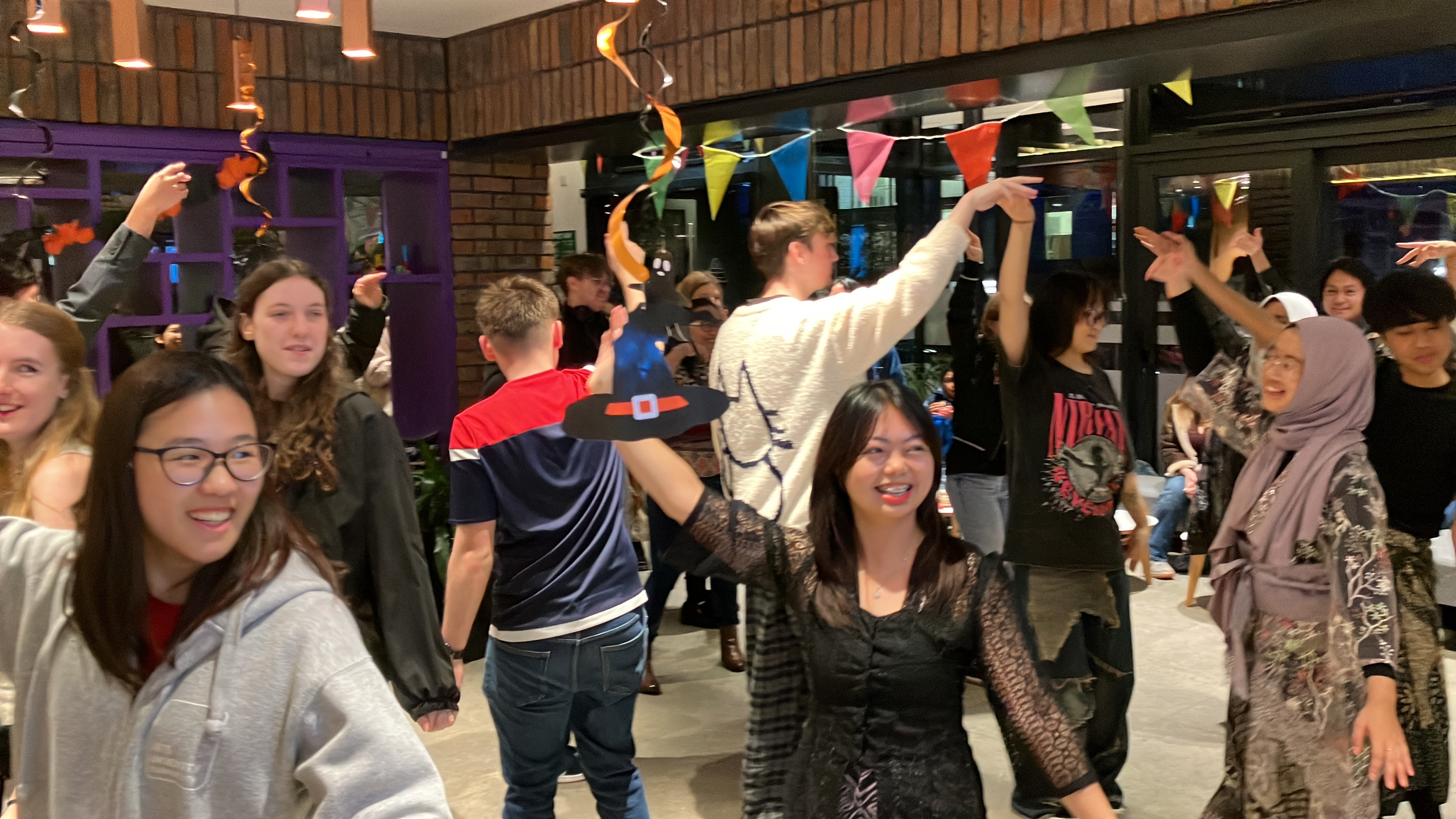 Several attendees of the Indonesian Cultural Harmony event at Madeira Road Halls of Residence taking part in a flashmob dance.