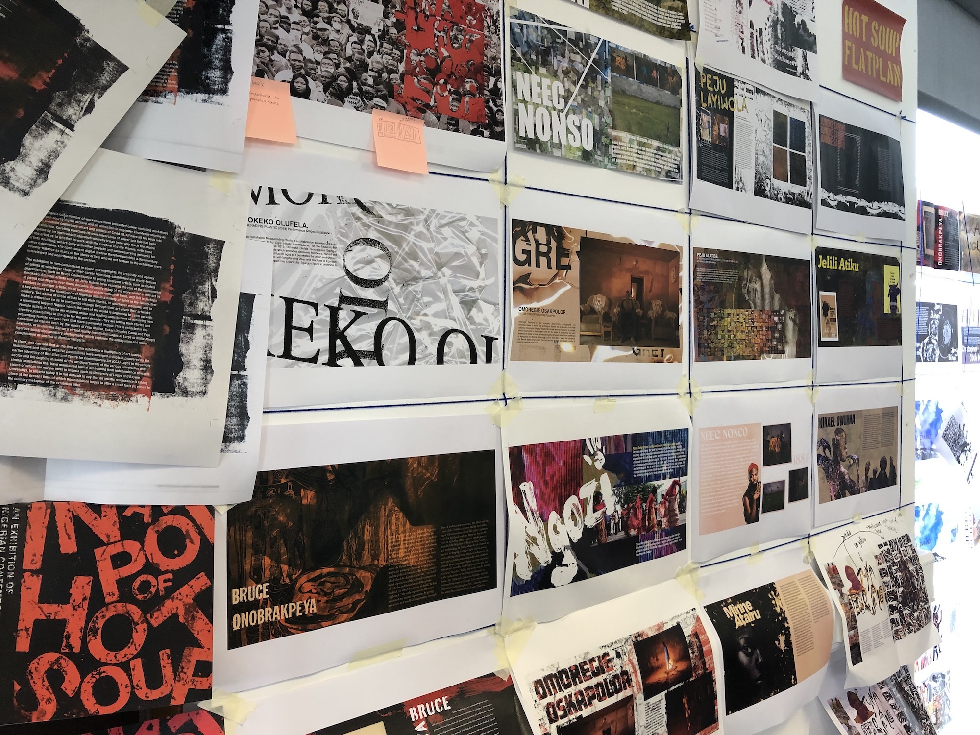 A series of posters with various large-print typography displayed on a wall.