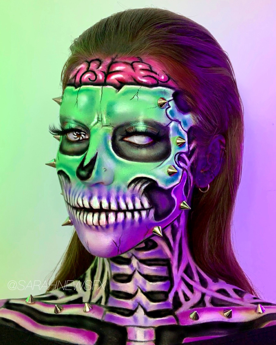Headshot of a model with colourful skeletal face and neck make-up. AUB Make-up graduate and TikTok star Sarah New's award-winning skull look.