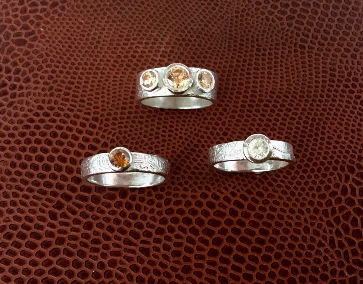Silver rings encrusted with stones