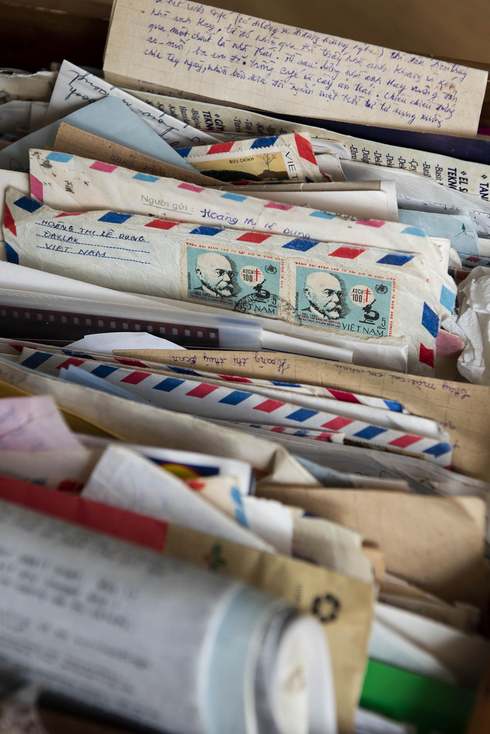 Close-up of old letters and documents in a box.
