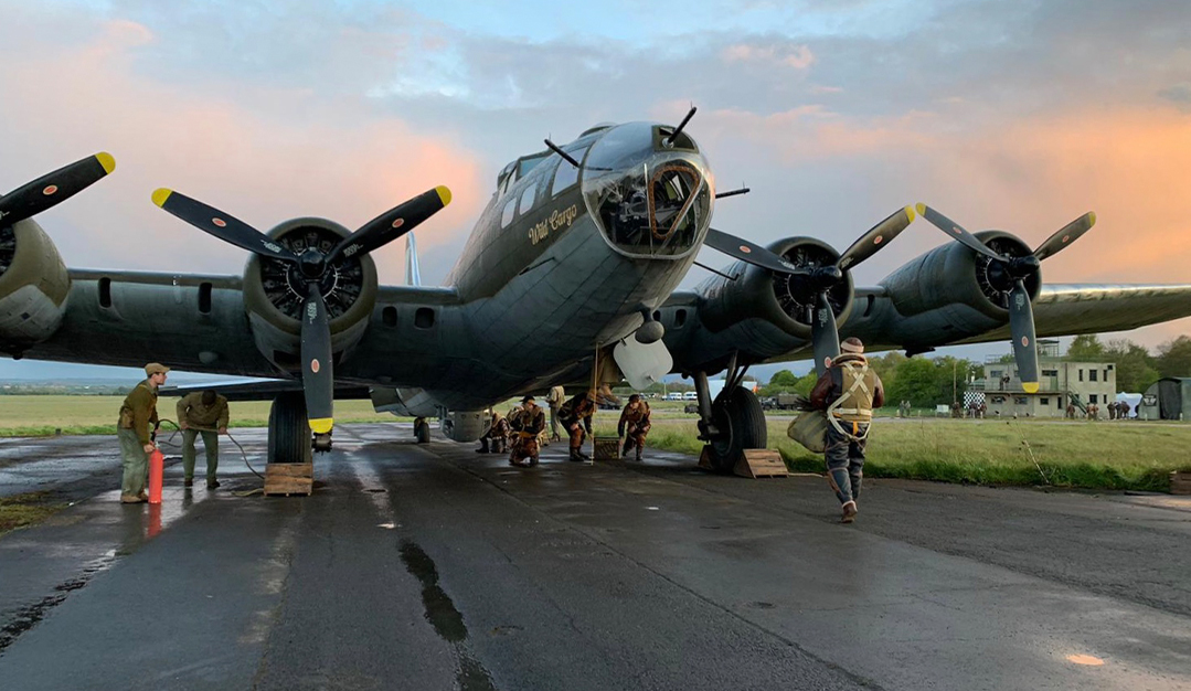 A large aircraft on a runway built for "Masters of the Air" by BGI Supplies.