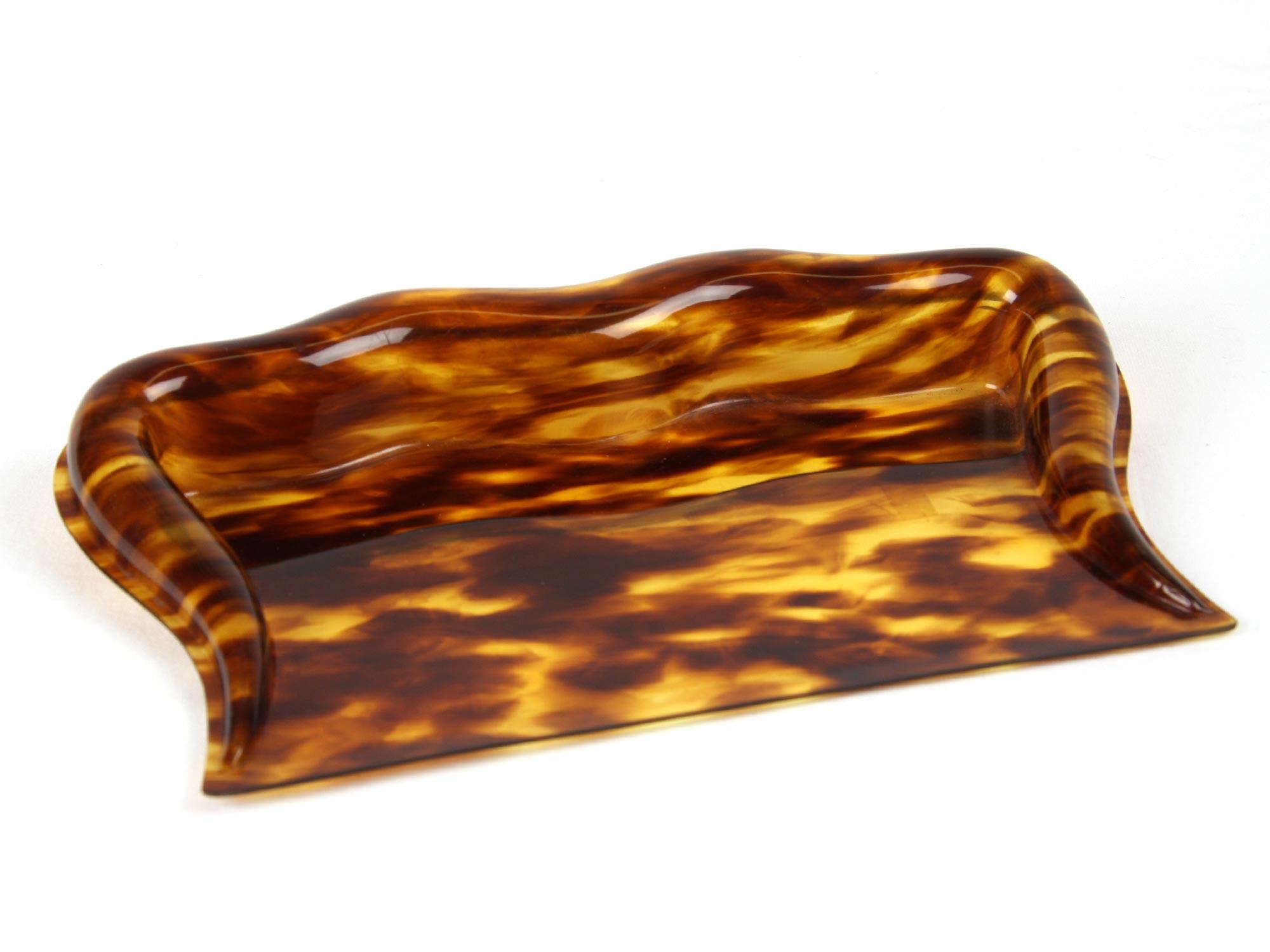 Plastic item with a black and amber pattern