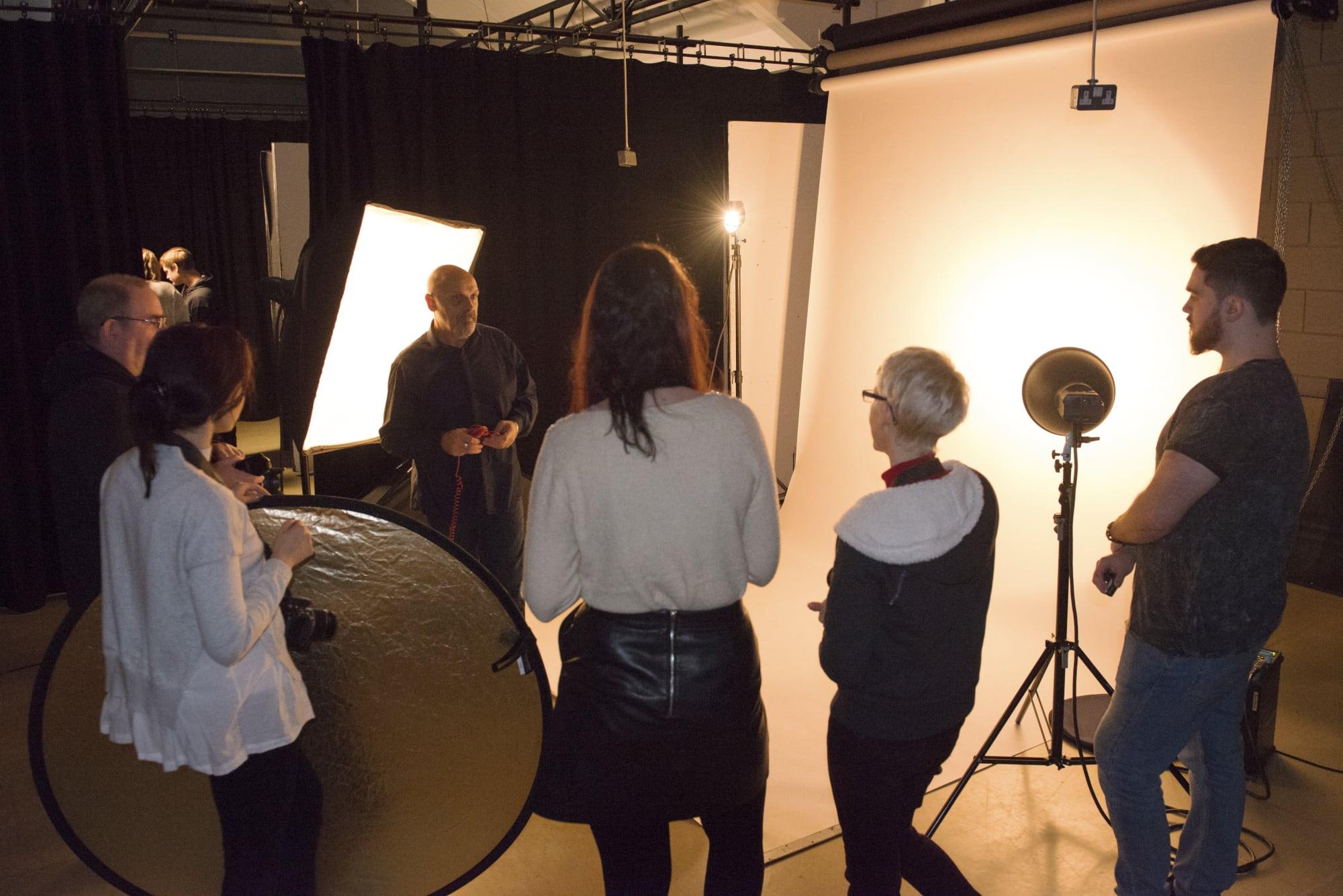Tutor teaching a photography class.