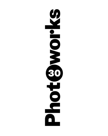 White banner with black text going vertically, reading "Photoworks". The number 30 is inserted into the second O.