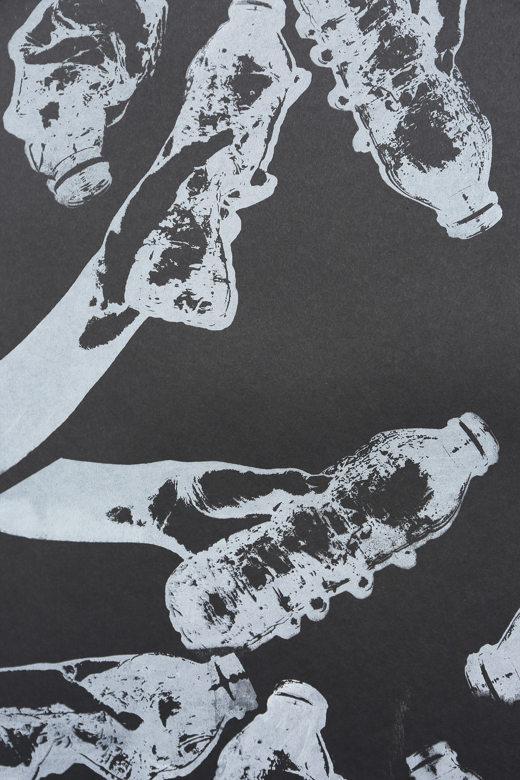 White silhouettes of hands and bottles scattered across dark grey background with distressed, textured surfaces and black patches.