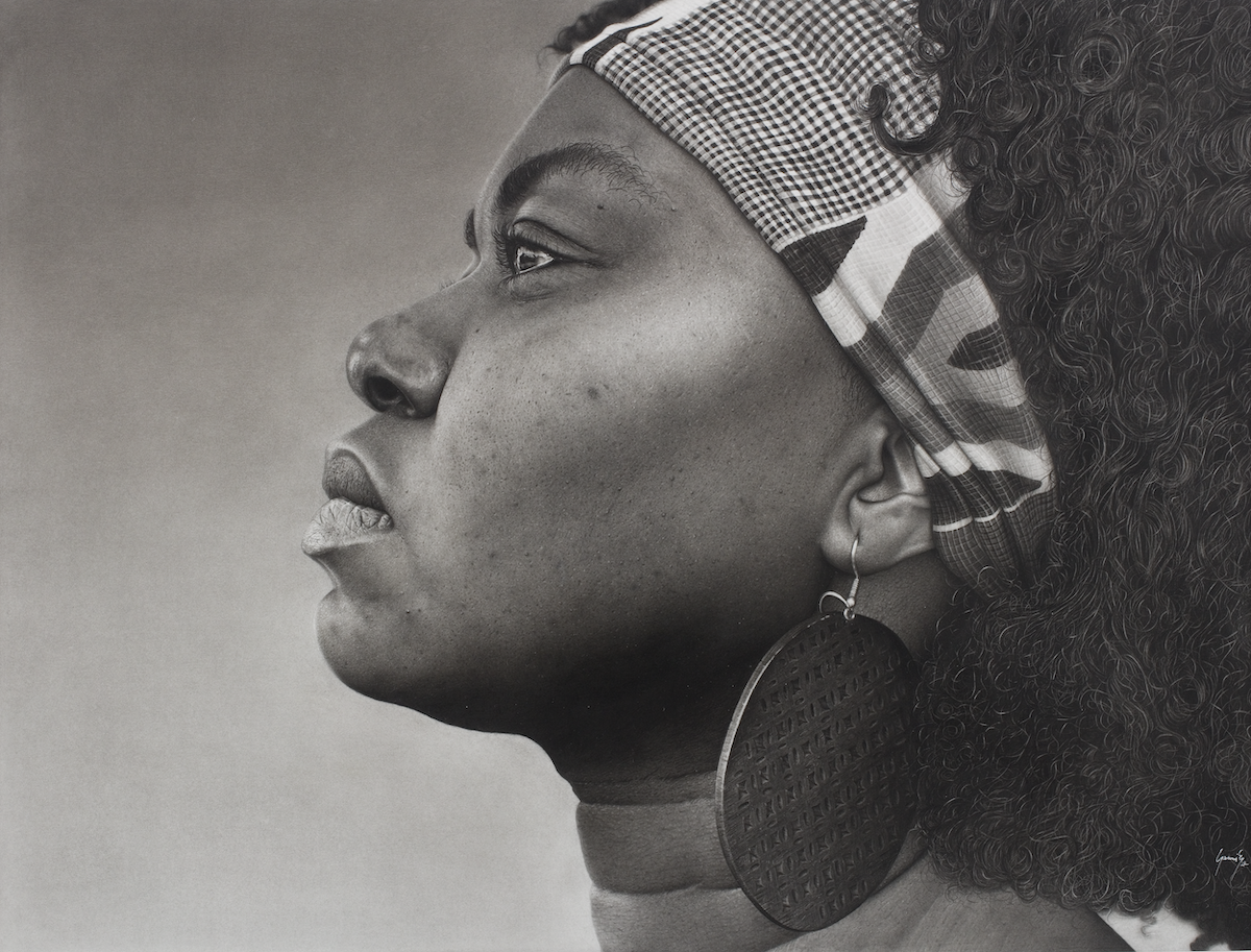 A hyper-realistic black-and-white drawing of a woman looking into the distance, close-up.