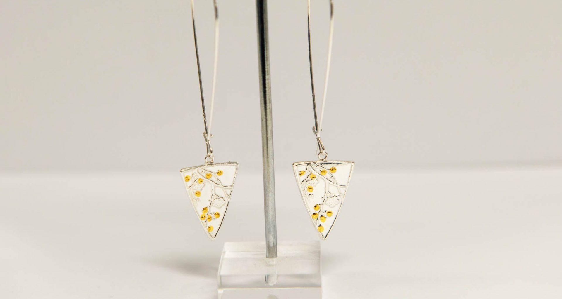 Silver necklaces on a stand