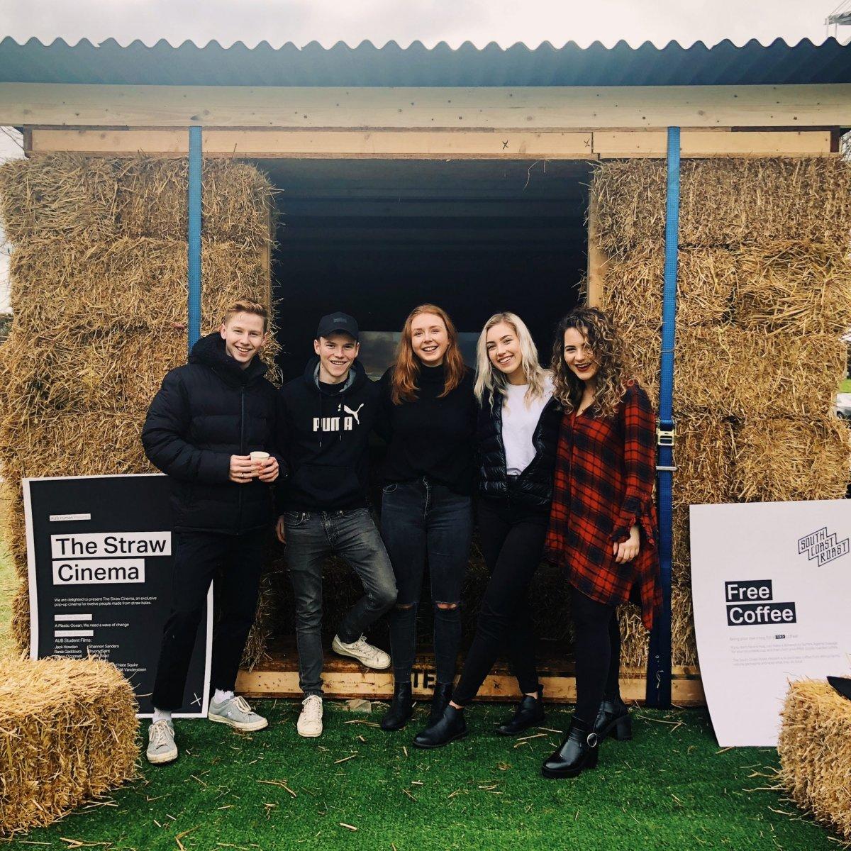 AUB Human volunteers stood by a straw bale
