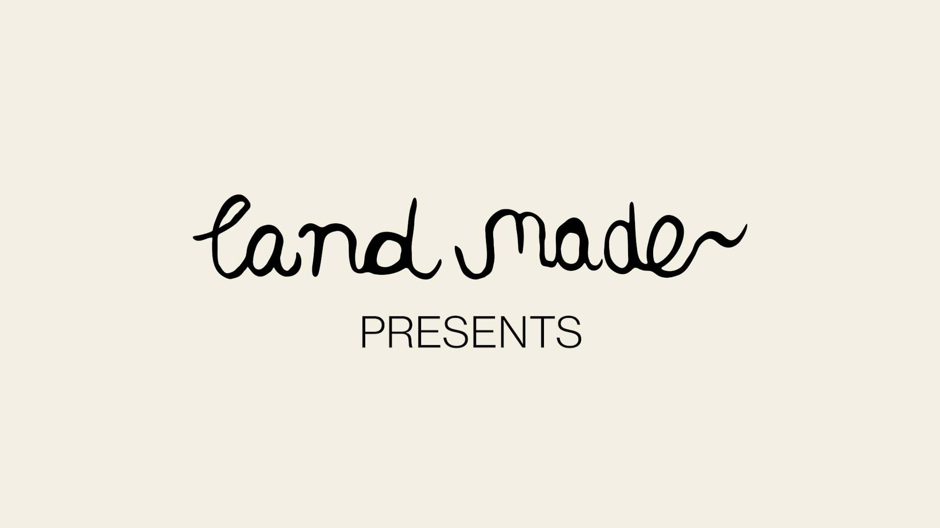 Black handwritten text "land made~" above grey sans-serif text "PRESENTS" on pale pink background.