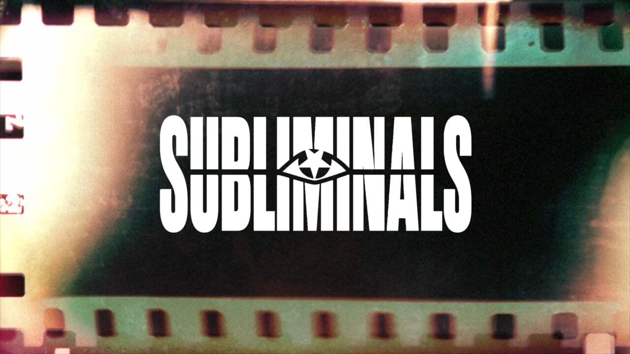 Film strip frame with "SUBLIMINALS" text in white letters and eye symbol, surrounded by light leaks in pink and green tones.