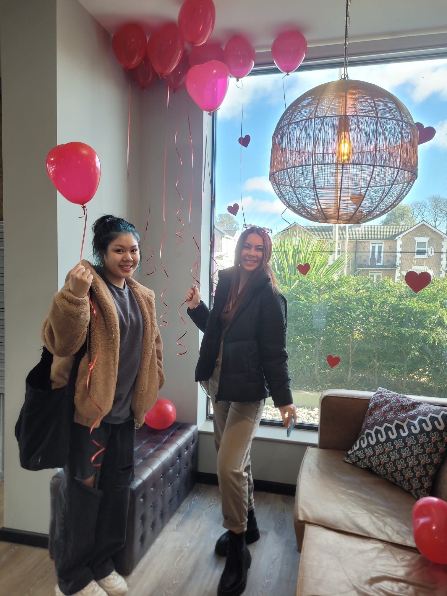 students with balloons celebrating Valentine's Day in Halls of Residence