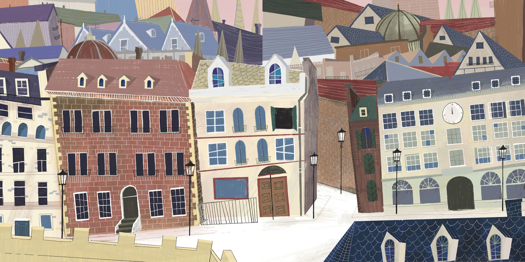 A townscape with several three-storey buildings and a street running in between them. The roofs of several other buildings are visible in the background.