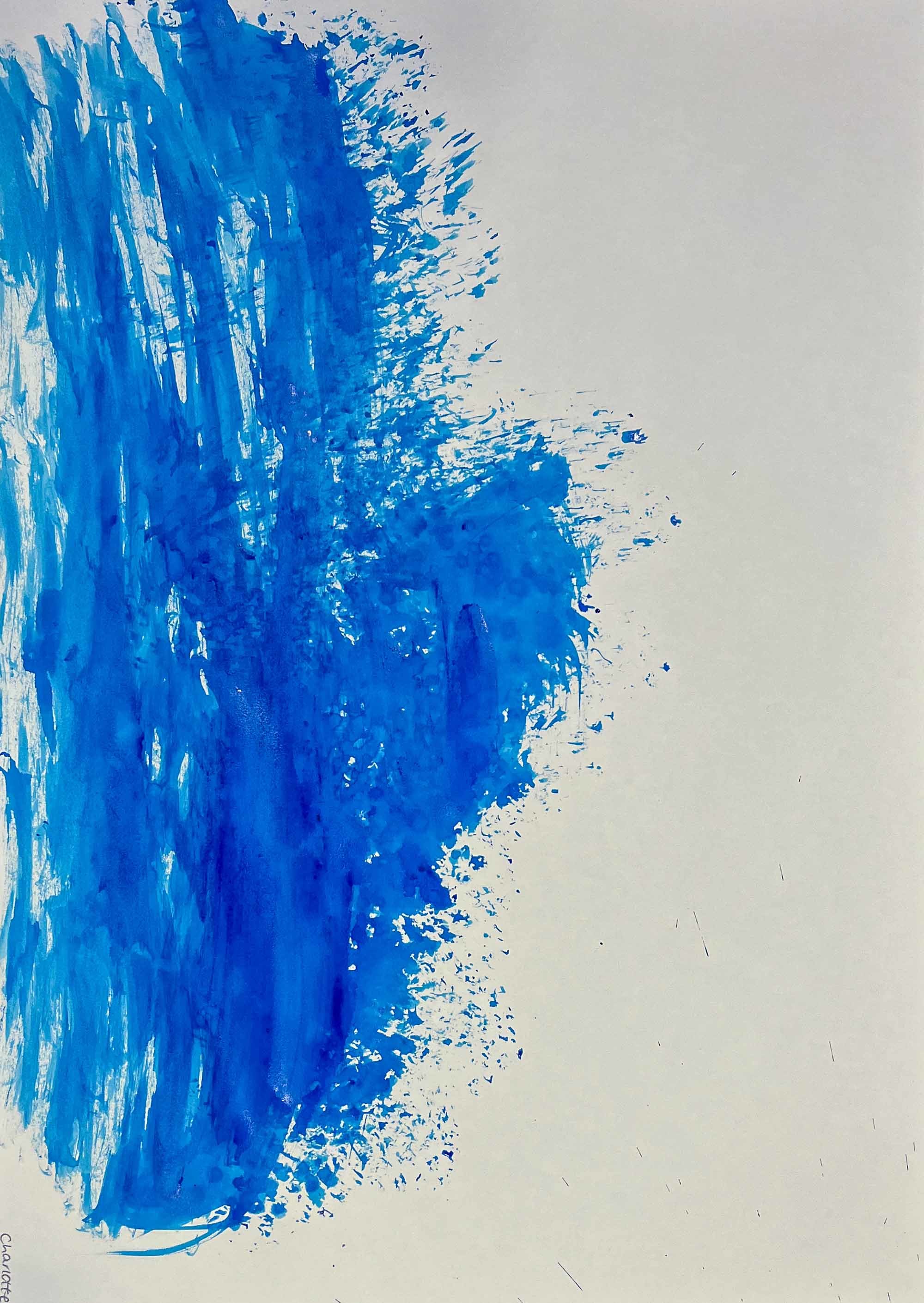 Large brush of blue paint on one side of a canvas