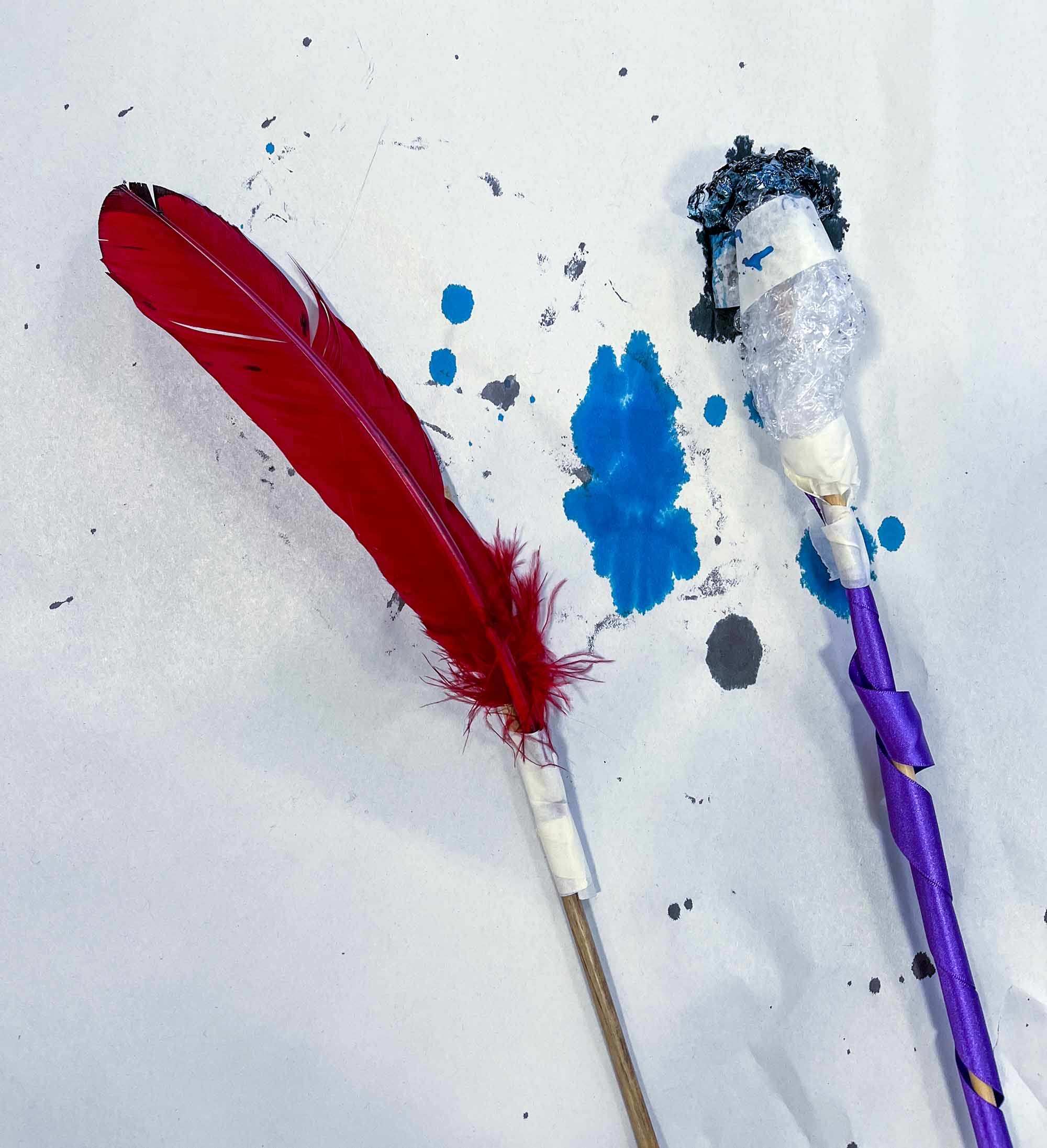 Red feather and a painting tool