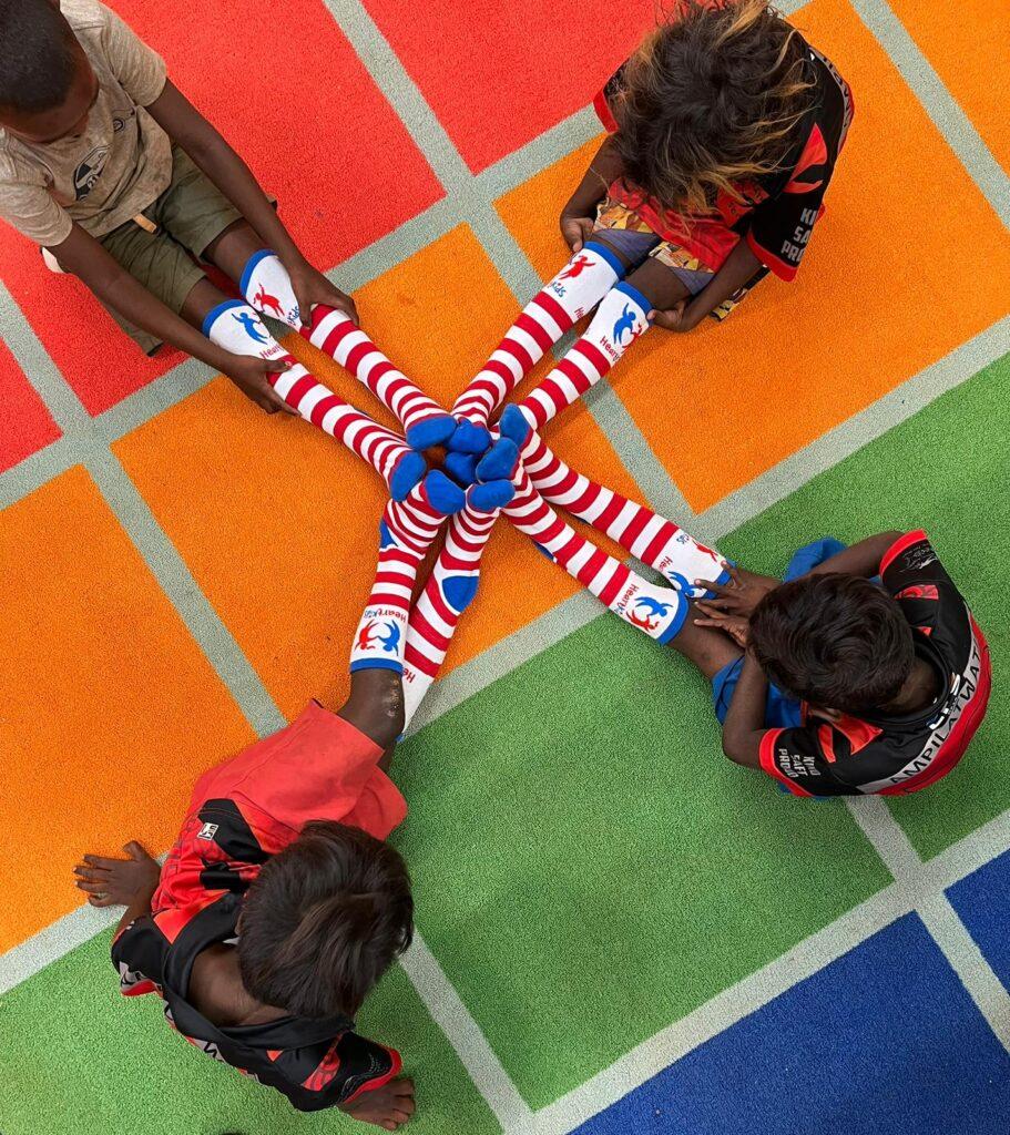 Deadly Heart Trek Central four children in stripy socks 911x1024