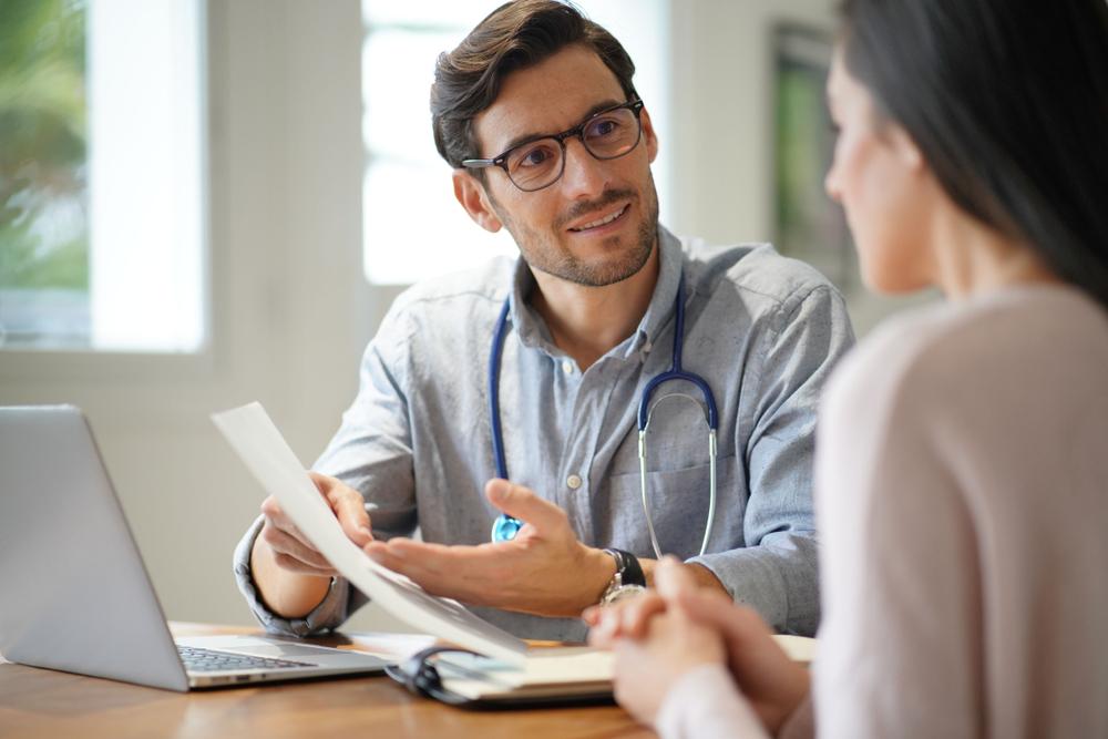 A GP doctor referring patient to a specialist