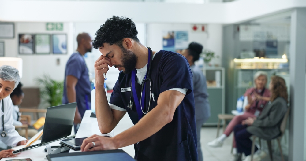young doctor struggling with burnout and work-life balance
