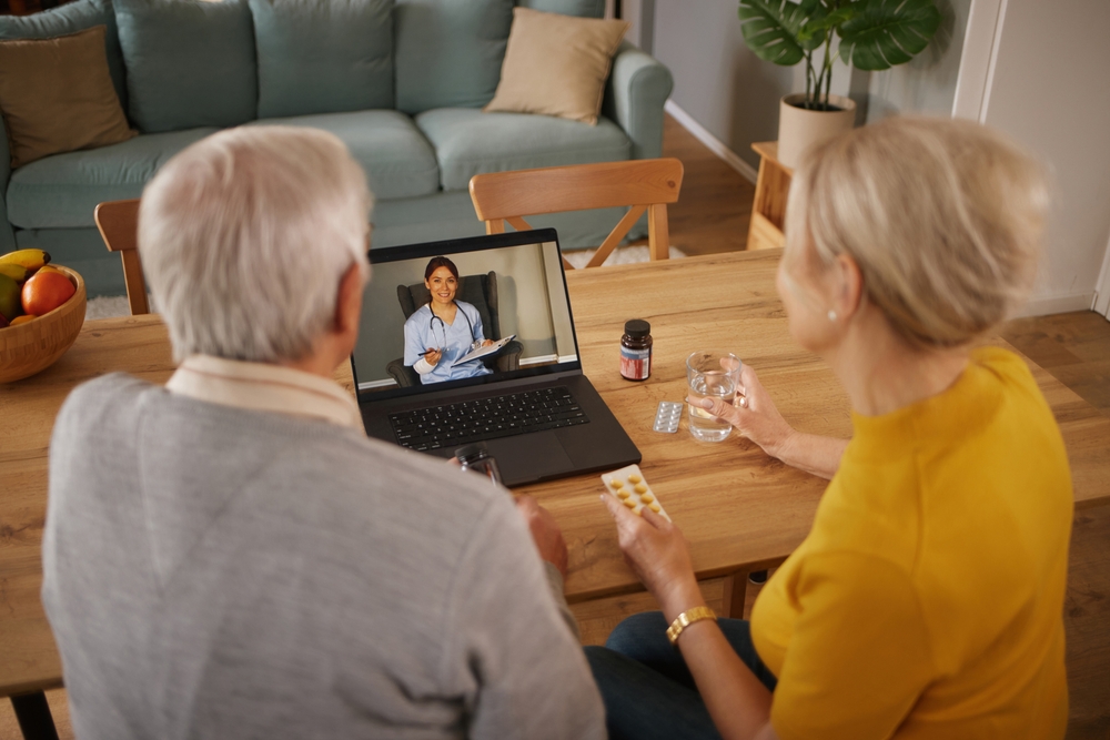 elderly couple on a virtural call with an emergency doctor in their living room