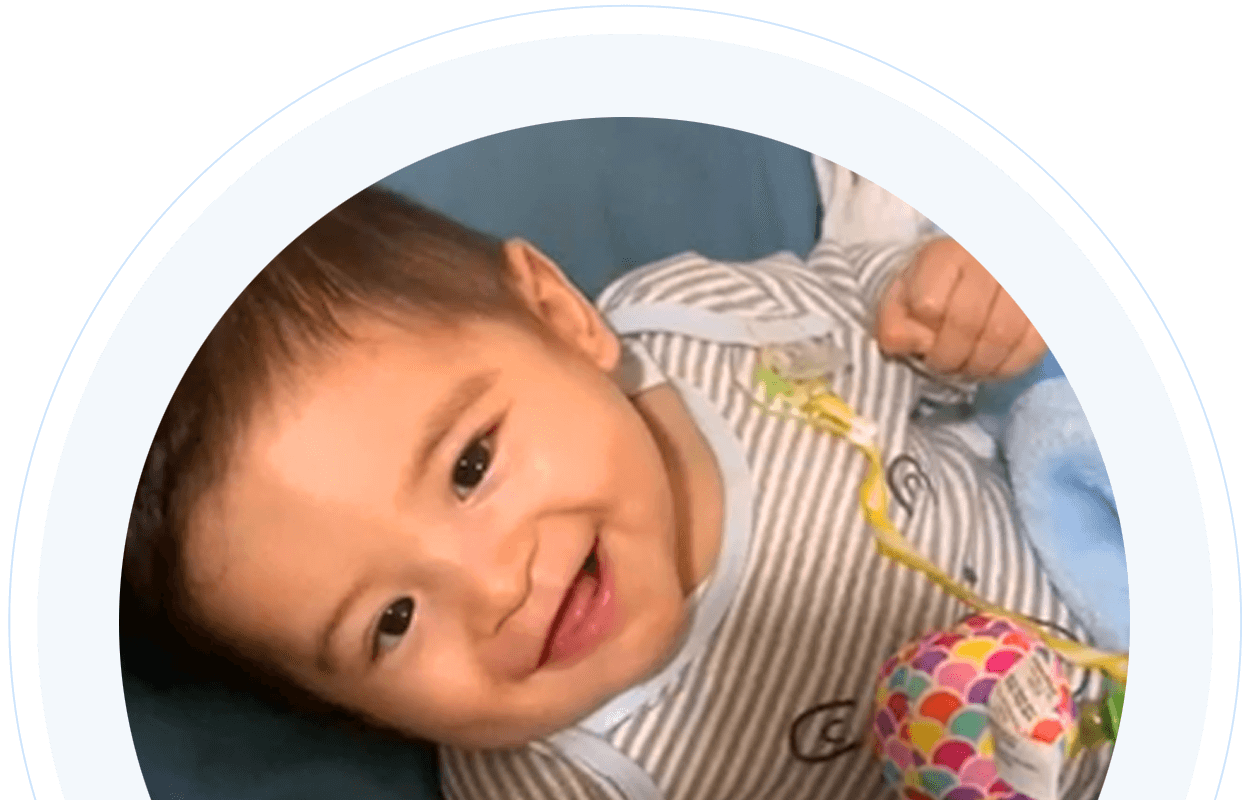 Toddler boy with cerebral palsy smiling