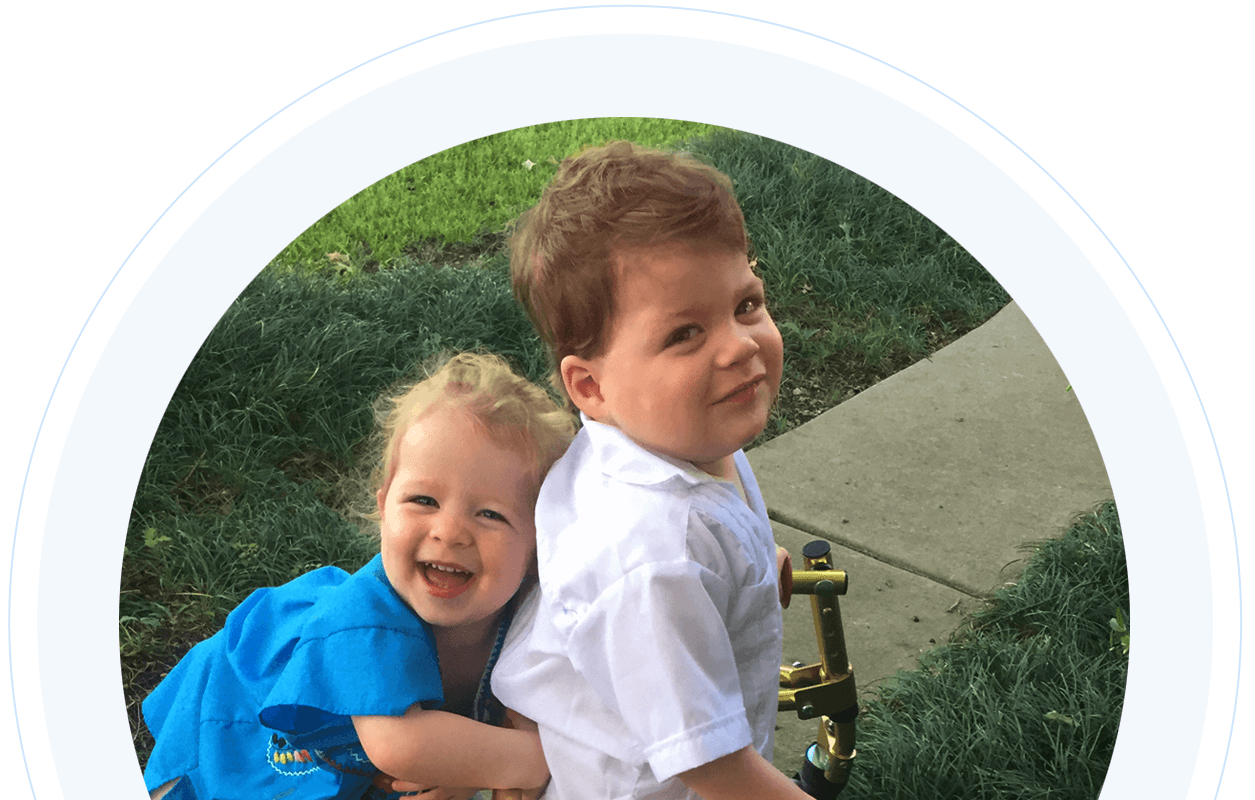 Toddlers sister and brother with cerebral palsy smiling