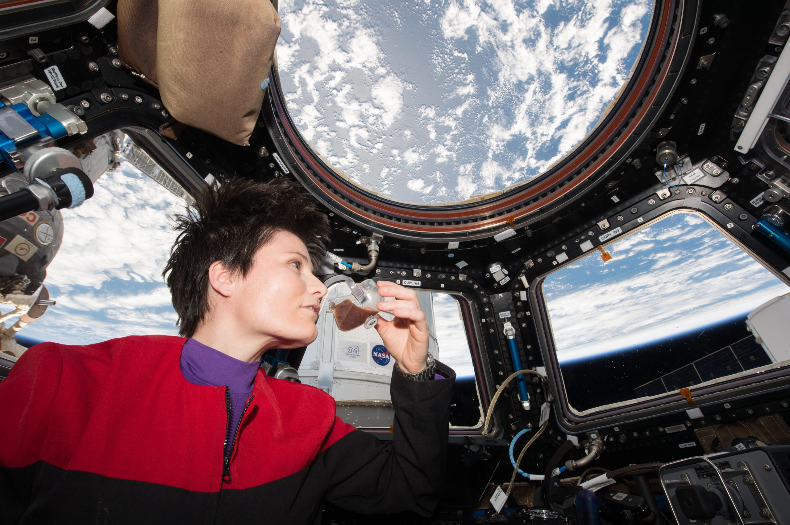 ISS 43 Samantha Cristoforetti drinks coffee in the Cupola scaled