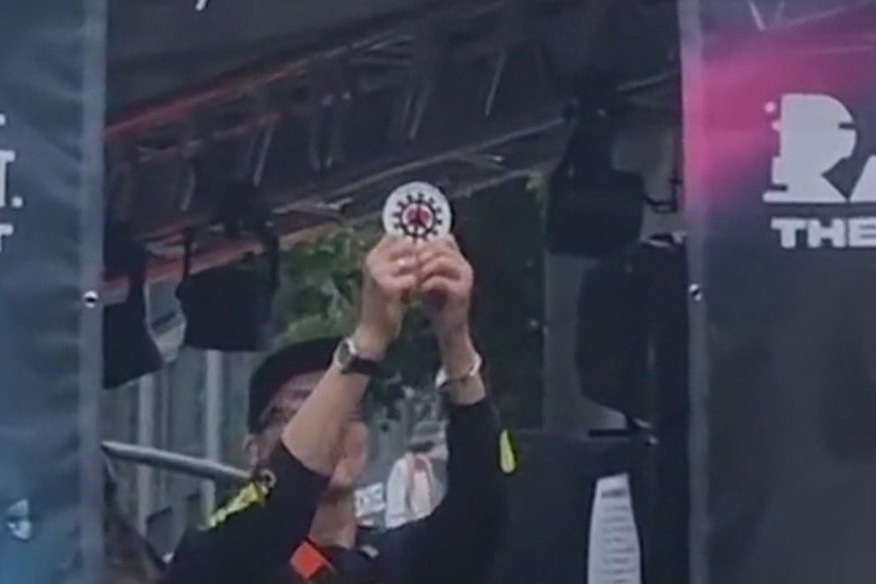 Rave the Planet organiser Dr. Motte criticised for holding up symbol of anti-lockdown movement Querdenker