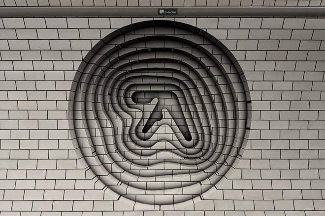 A new 3D Aphex Twin logo has appeared in a London tube station