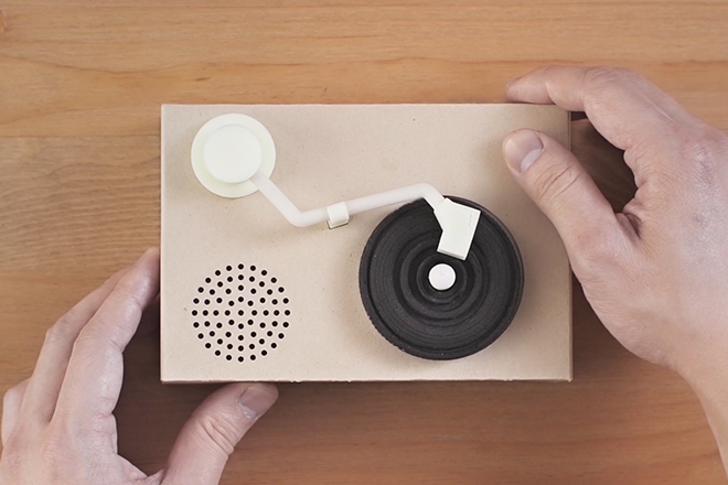 This cute little turntable actually plays mini cookie records