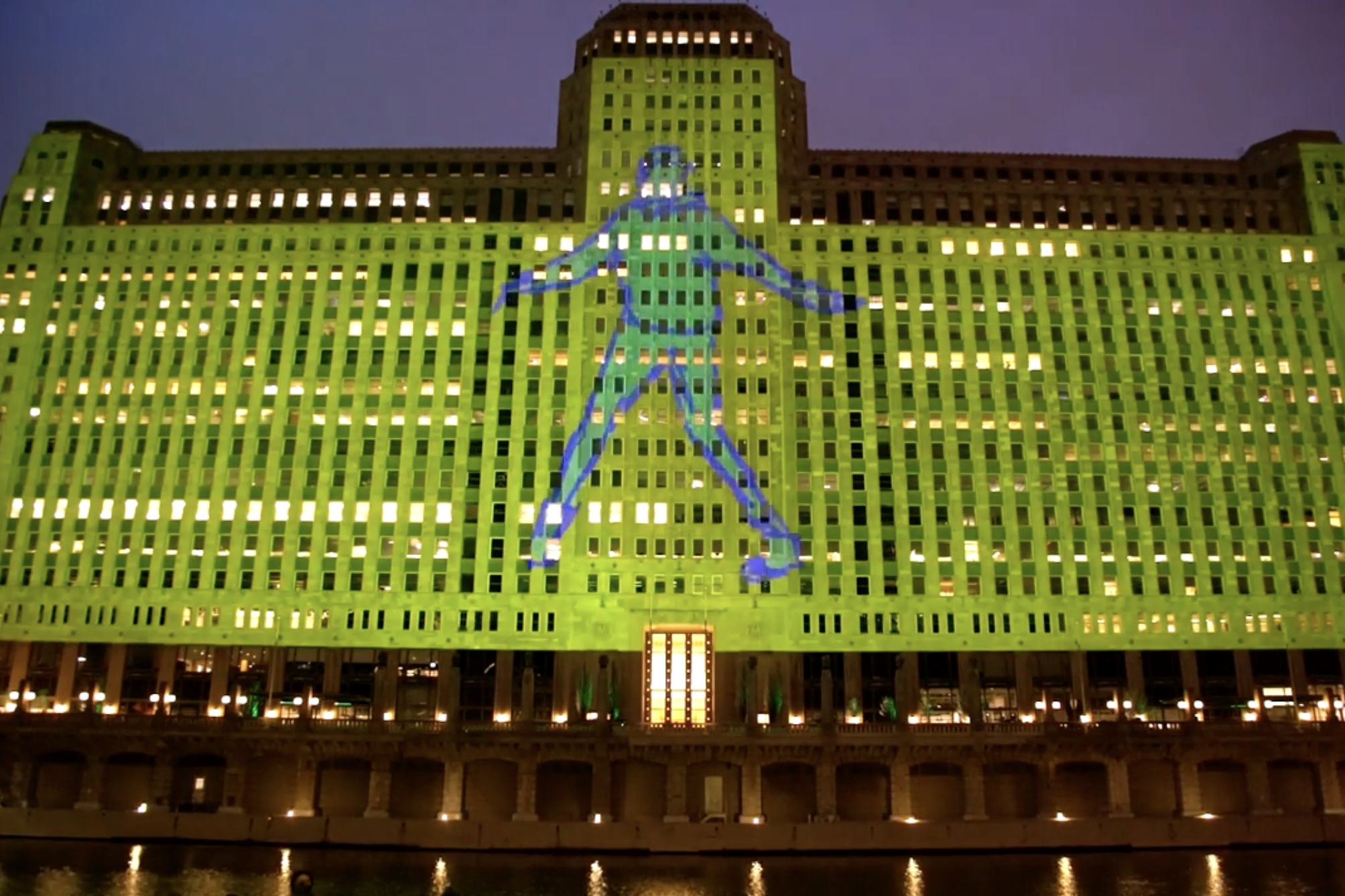 A footwork film is being projected onto a Chicago building