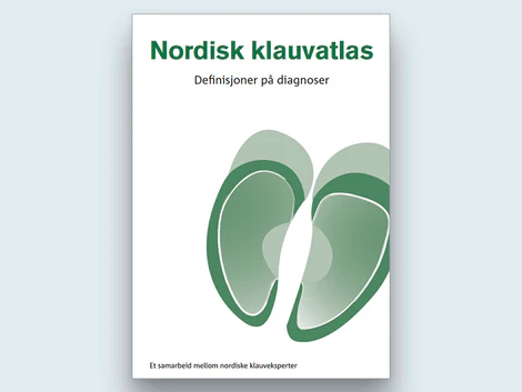Nordisk klauvatlas bok med definisjoner på diagnoser hos storfe.