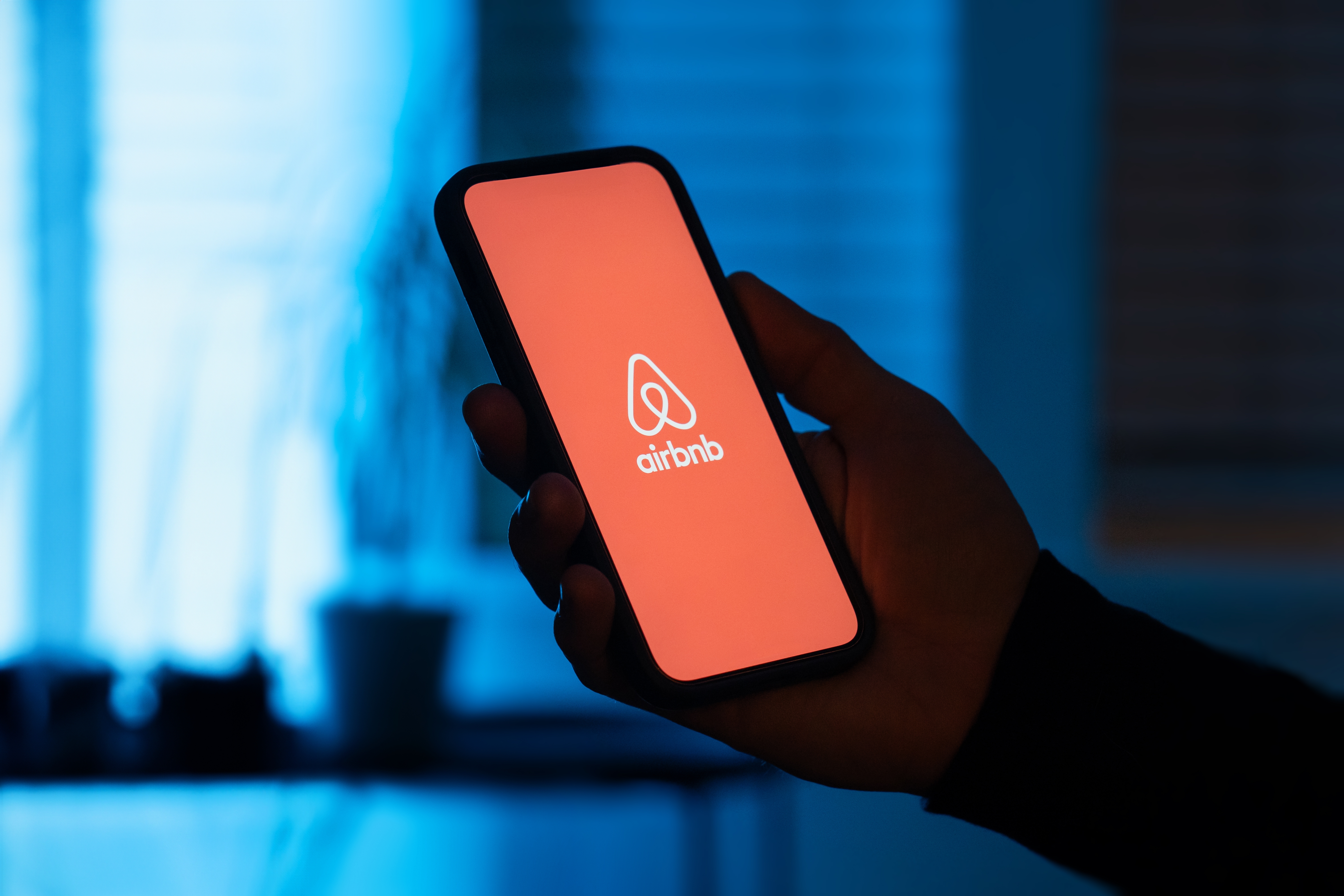 Airbnb logo on smartphone