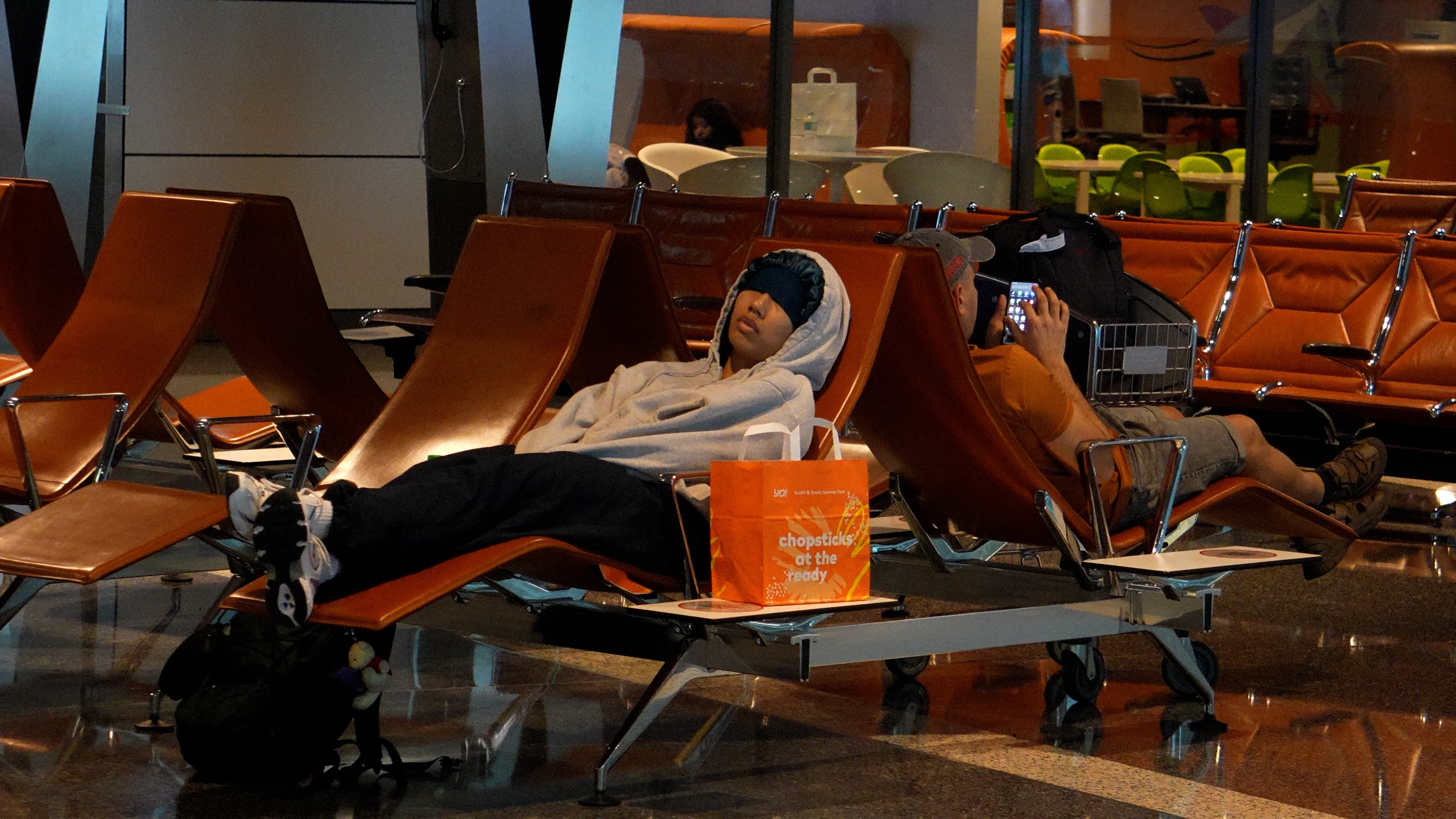 Napping passenger at Doha International Airport in Qatar