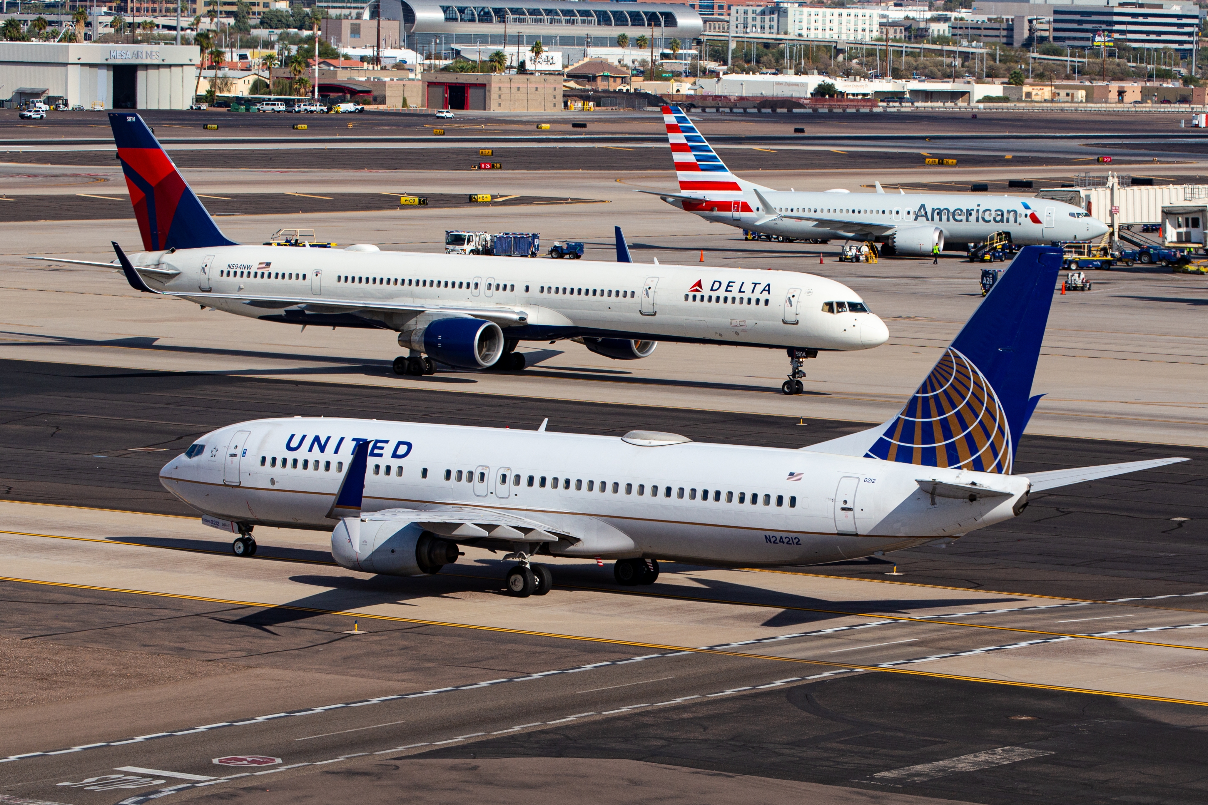 American, Delta, and United planes at Phoenix Sky Harbor International Airport
