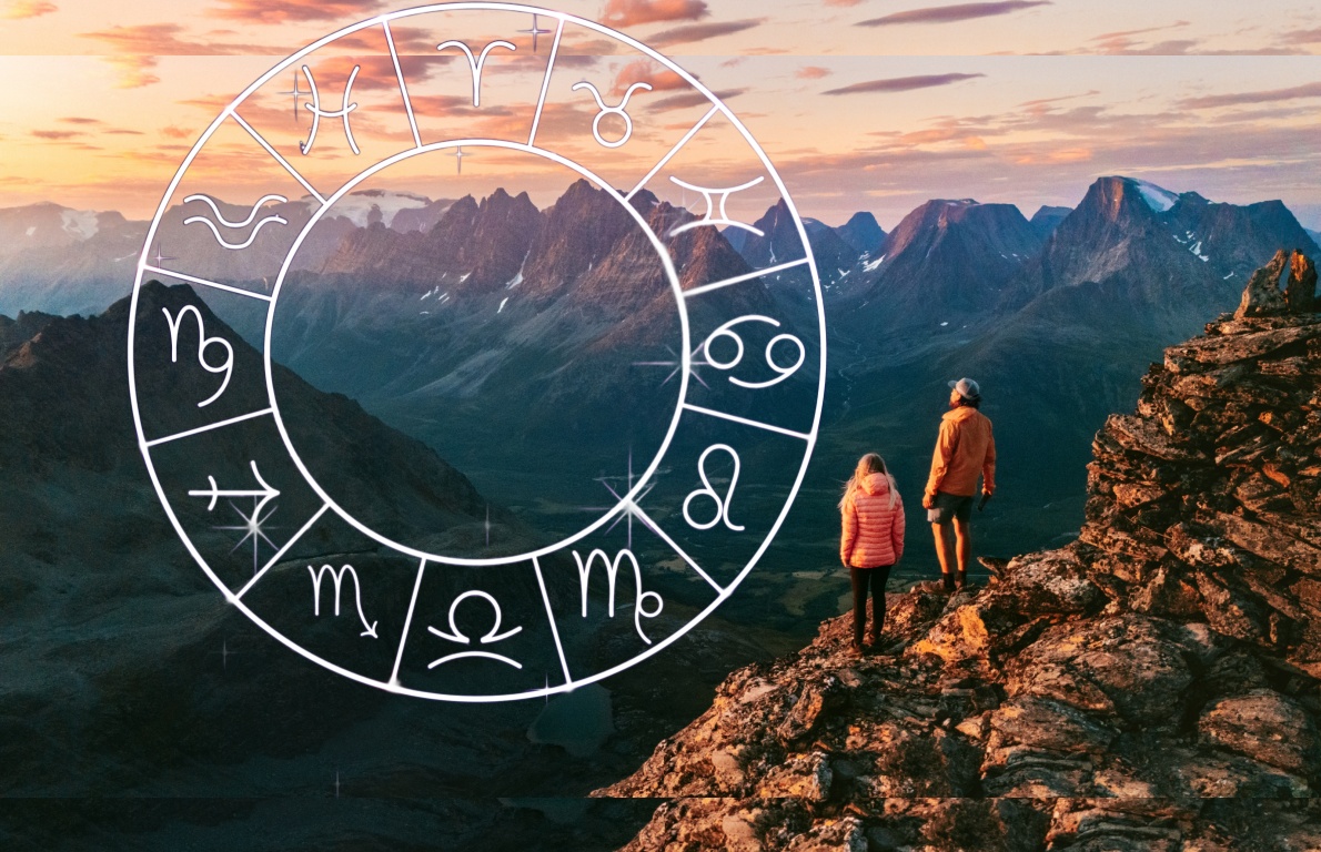 Signs of the zodiac in the sky above mountain hikers