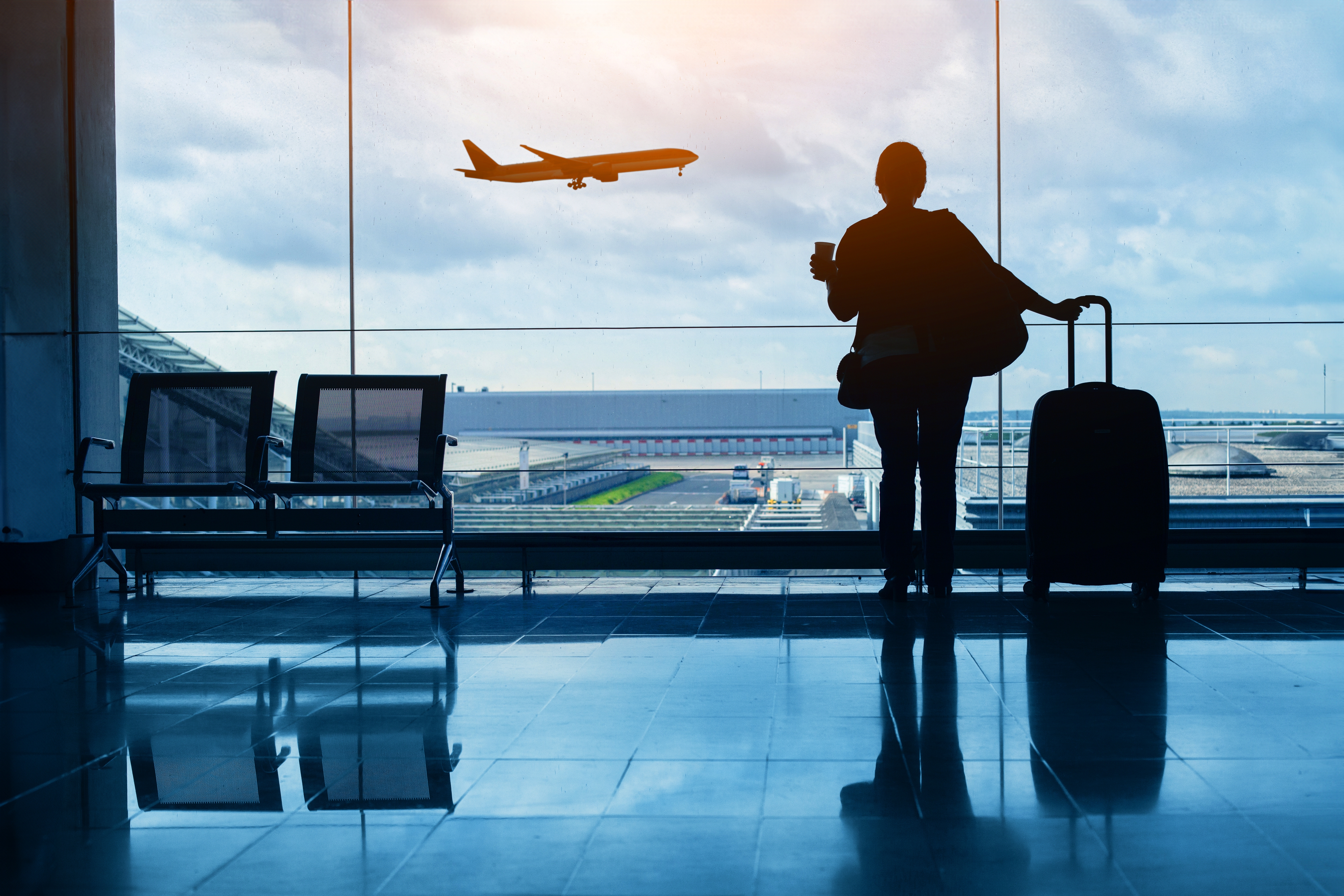 Watching a departing flight at the airport