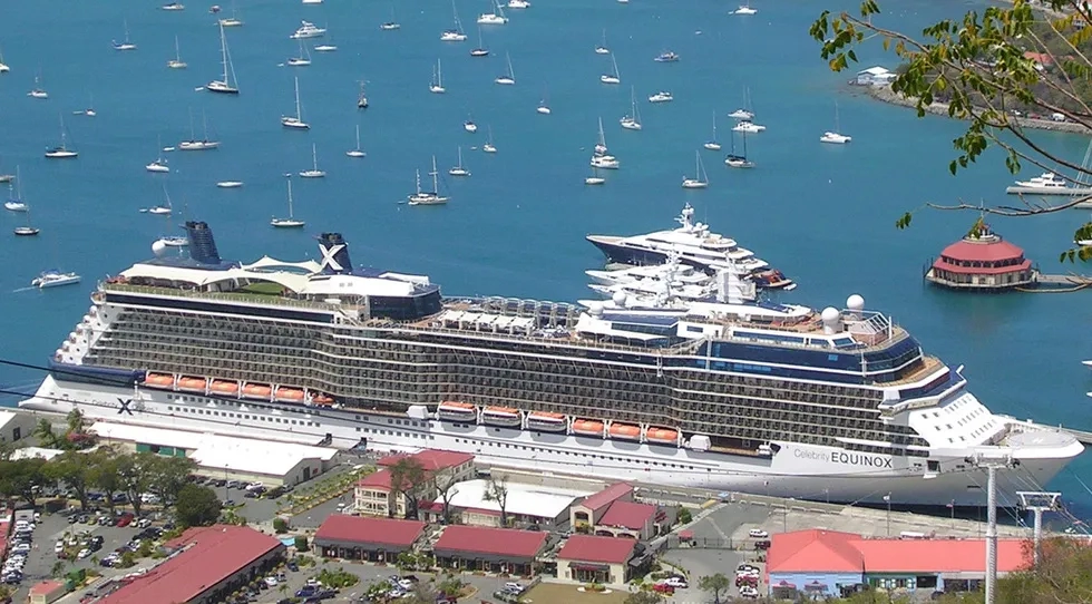 The Celebrity Eqinox surrounded by smaller boats in the harbor of St. Thomas