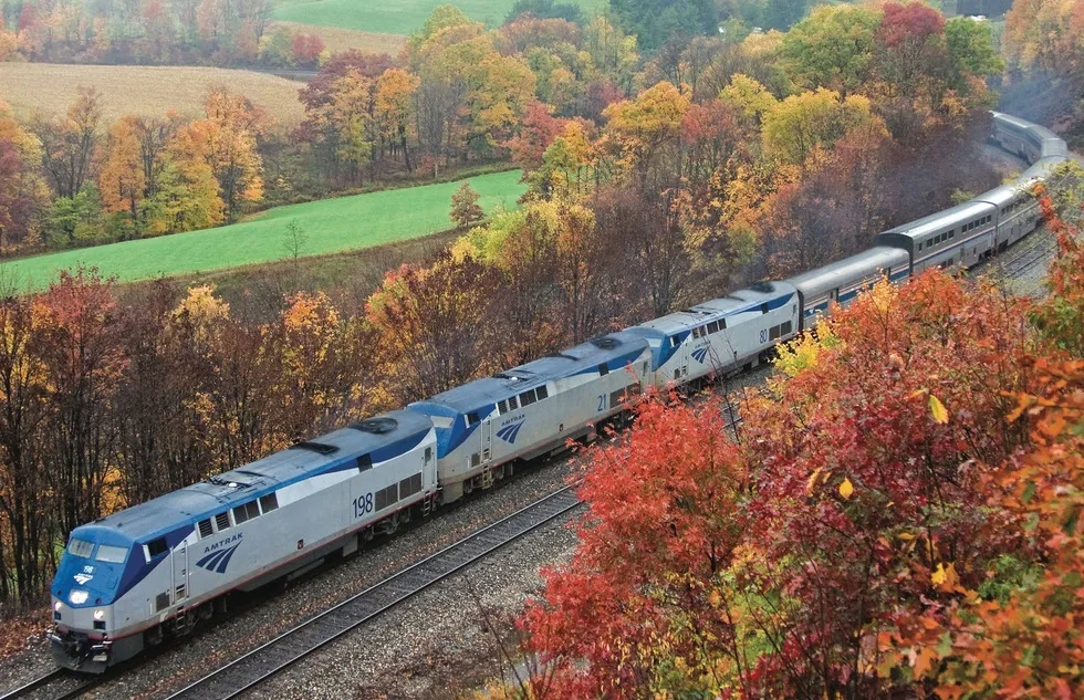 Amtrak train amid fall foliage in the Allegheny Mountains