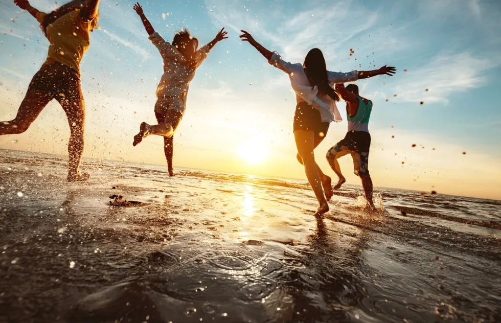 Beach frolicking at sunset