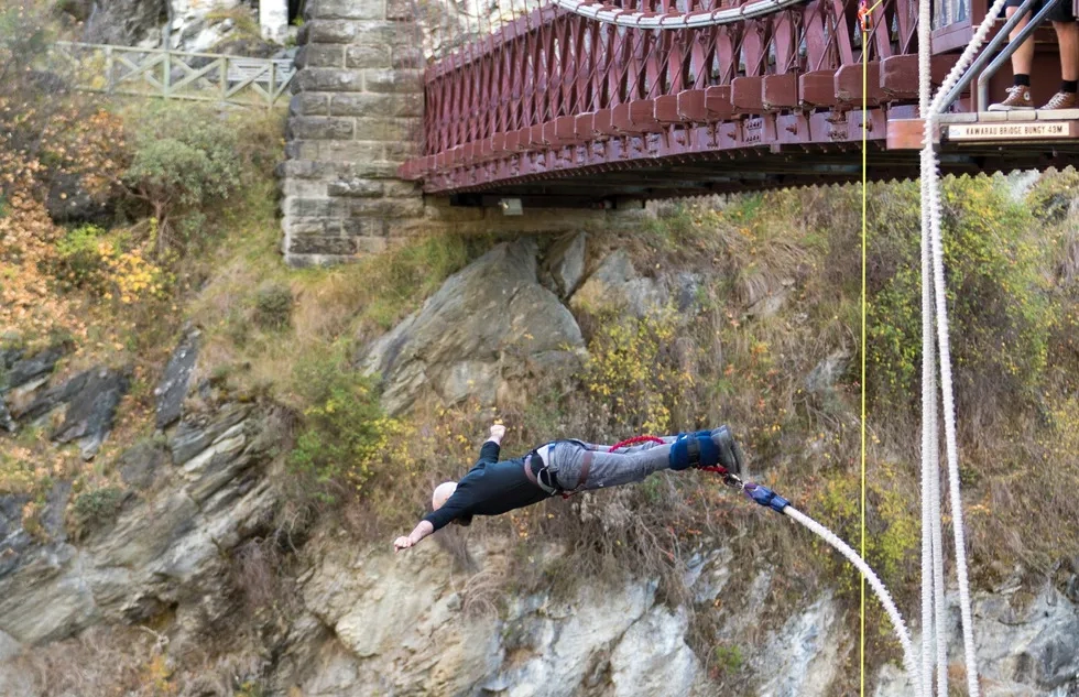 A bungee jumper soars over the Kawarau Gorge near Queenstown, New Zealand